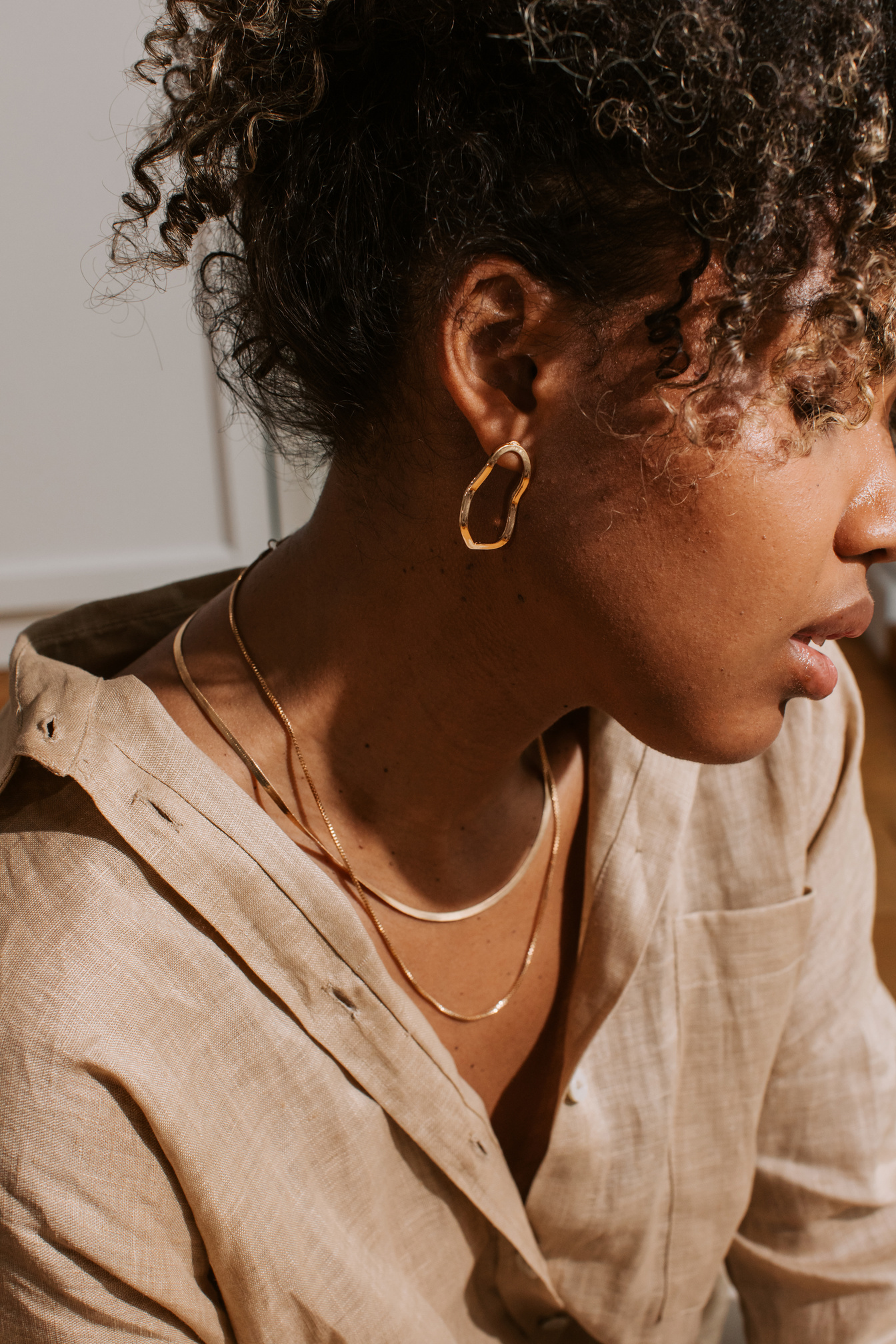 Woman Wearing Gold Jewelry