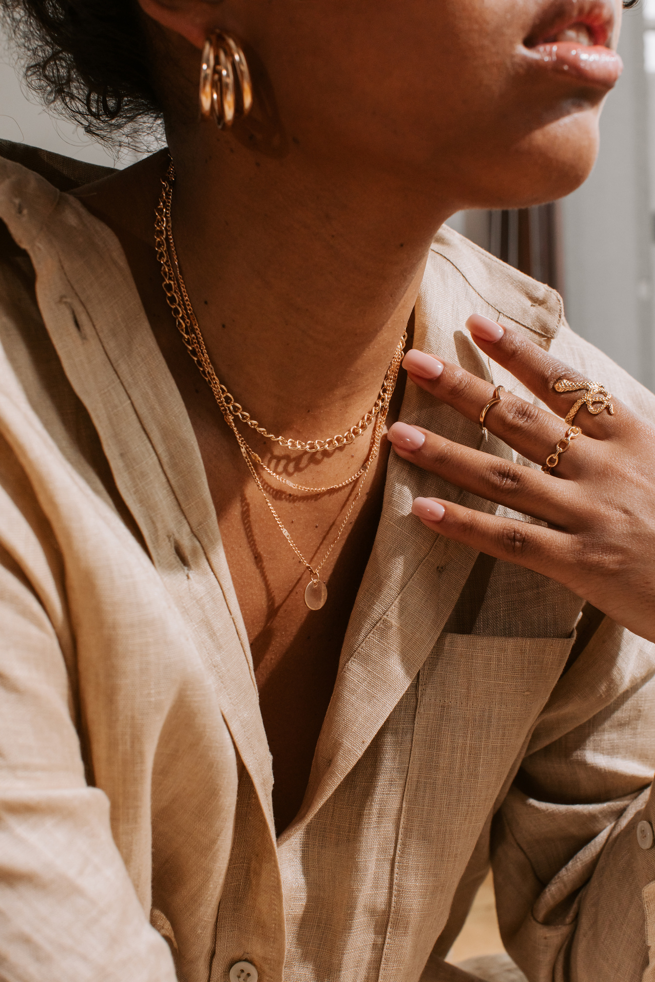 Woman Wearing Gold Jewelry